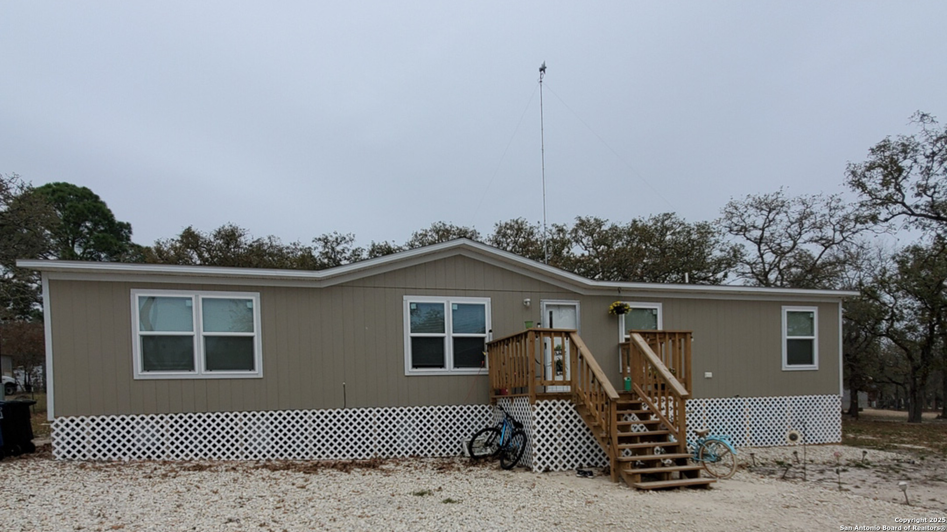 61 Post Oak Road, Unit A La Vernia, TX 78121 - Photo 1 of 11 a front view of a house with garden