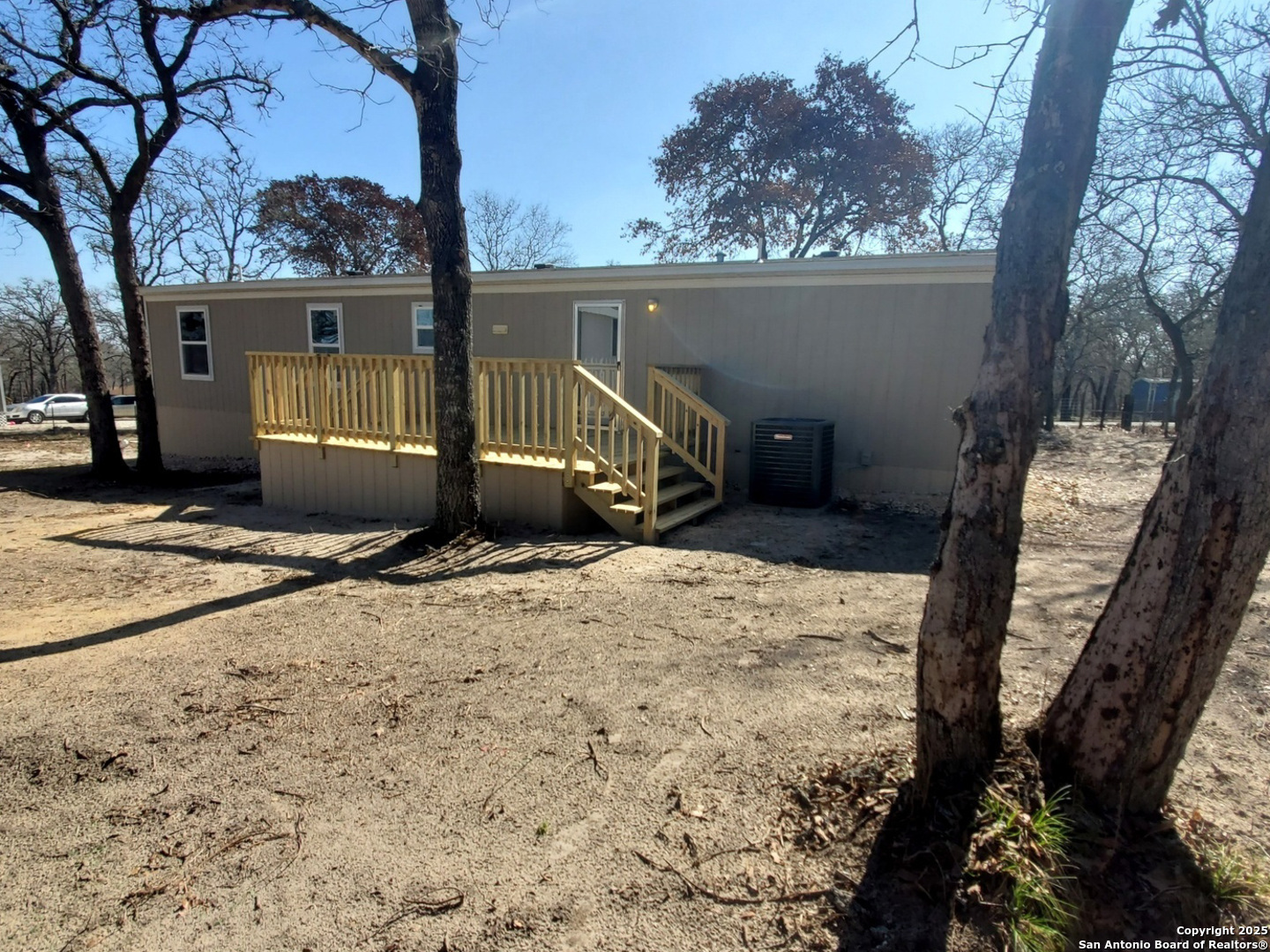 61 Post Oak Road, Unit A La Vernia, TX 78121 - Photo 11 of 11 a view of a house with a snow in the yard