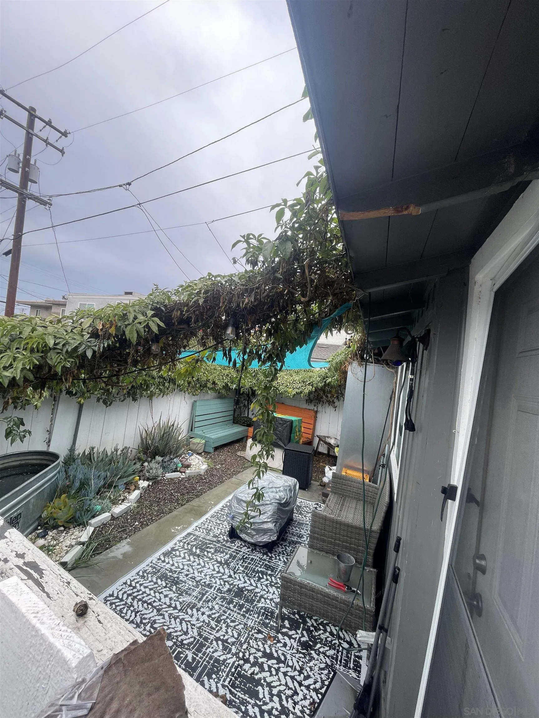 4667-69 35th Street San Diego, CA 92116 - Photo 20 of 29 a backyard of a house with garden and outdoor seating