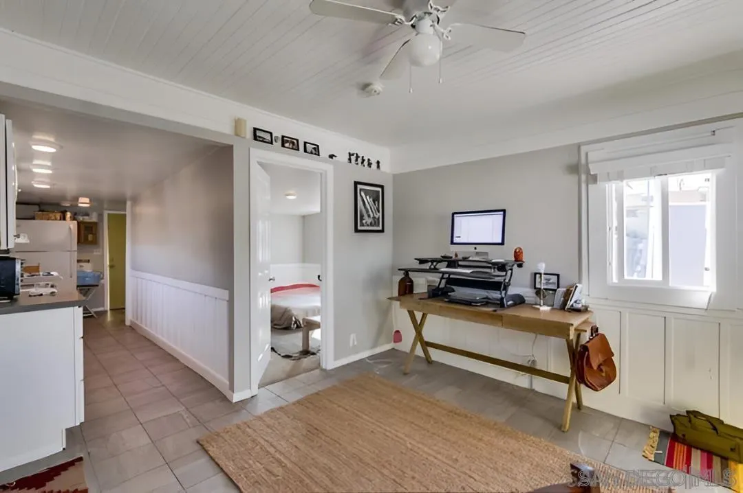 4667-69 35th Street San Diego, CA 92116 - Photo 22 of 29 a living room with furniture and a flat screen tv