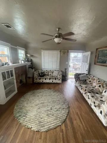 a kitchen with lots of counter top space appliances and furniture