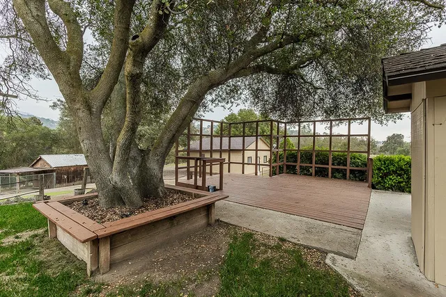 a view of an empty room and wooden floor