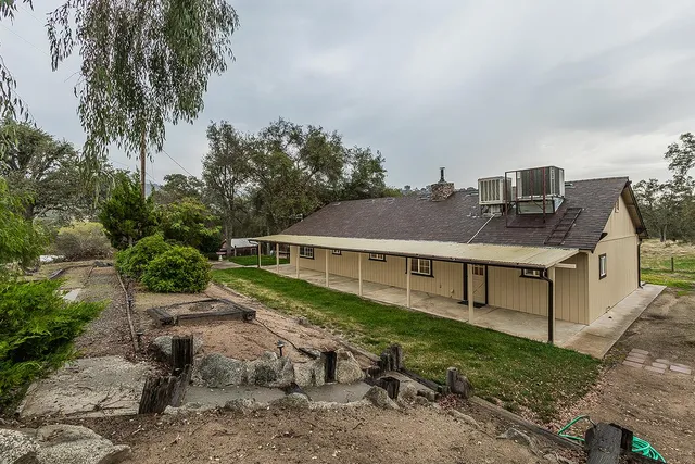 a view of a chandelier in an empty room with a window