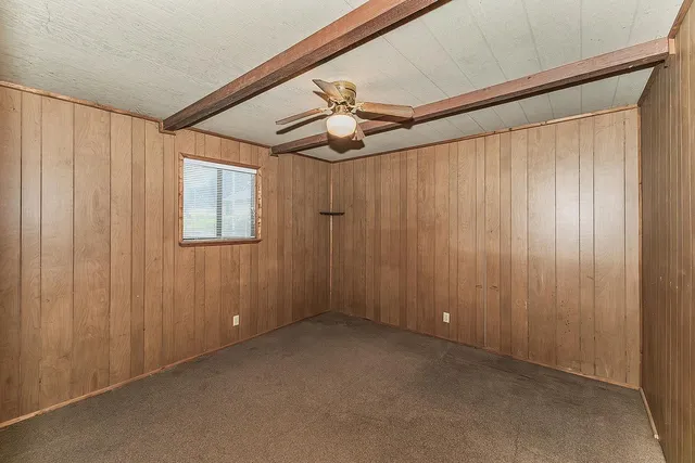 a spacious bathroom with a mirror a sink and a mirror