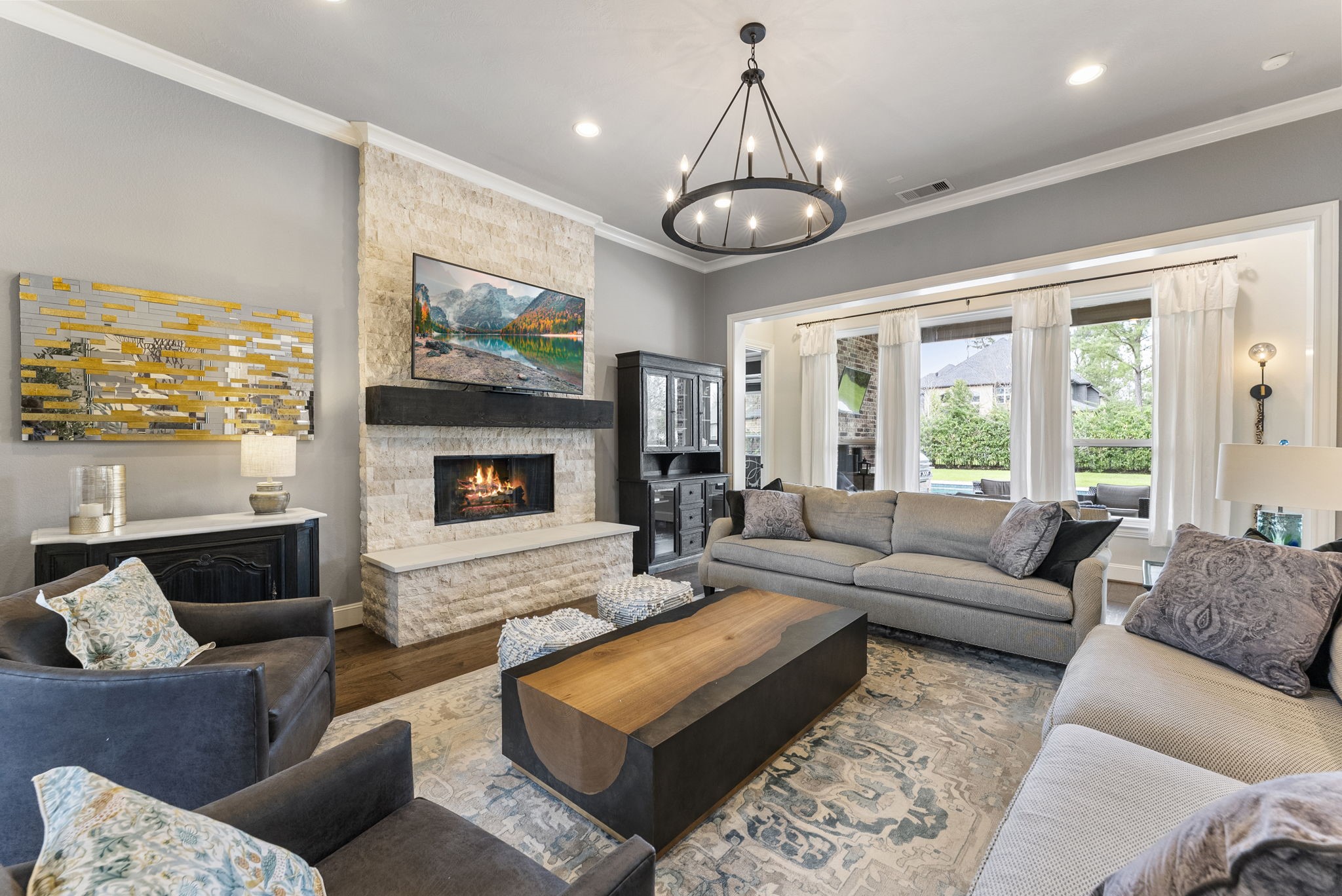 5519 Bright Timber Landing Drive Spring, TX 77386 - Photo 13 of 39 a living room with furniture a large window and a flat screen tv
