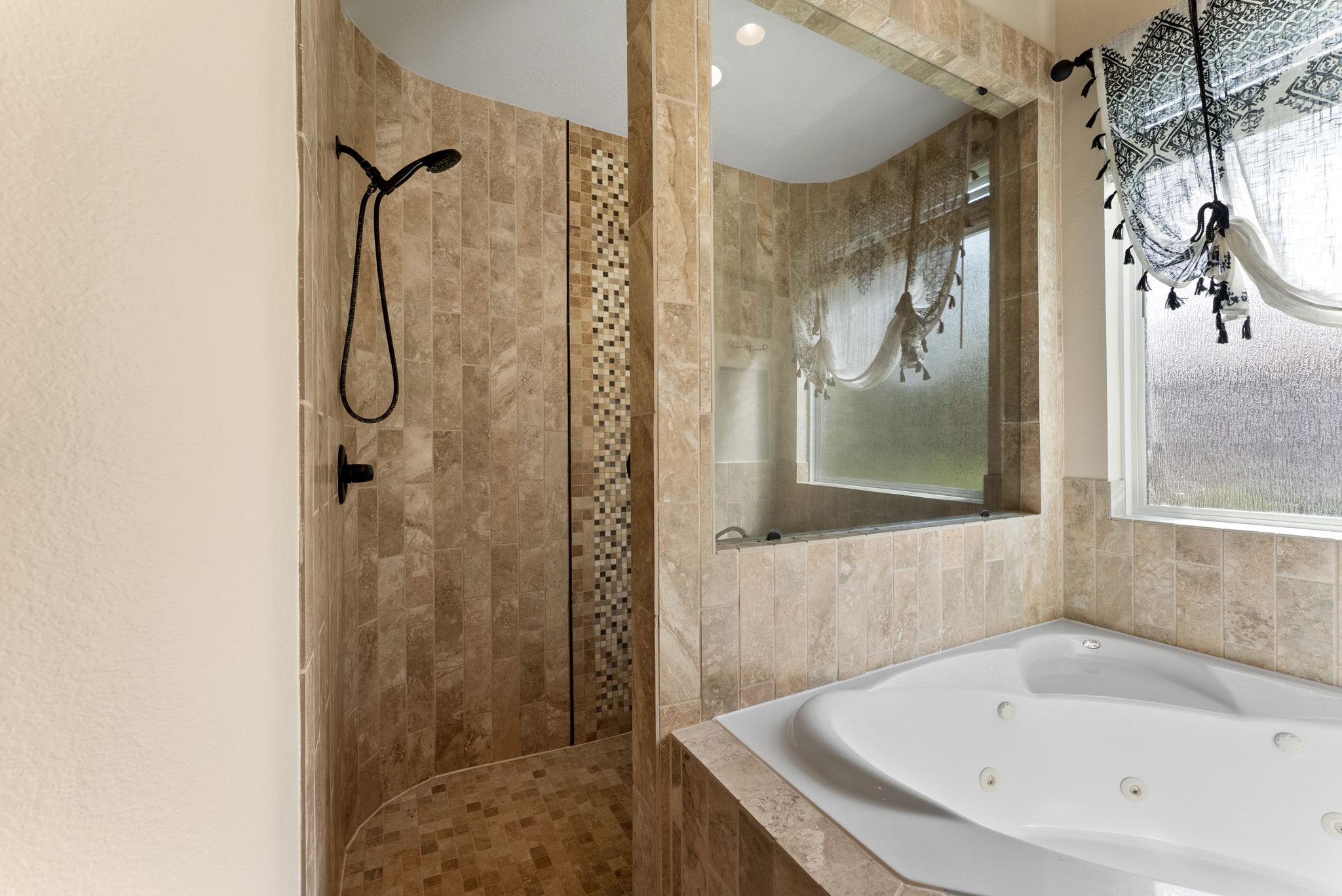 5519 Bright Timber Landing Drive Spring, TX 77386 - Photo 18 of 39 a bathroom with a tub and shower