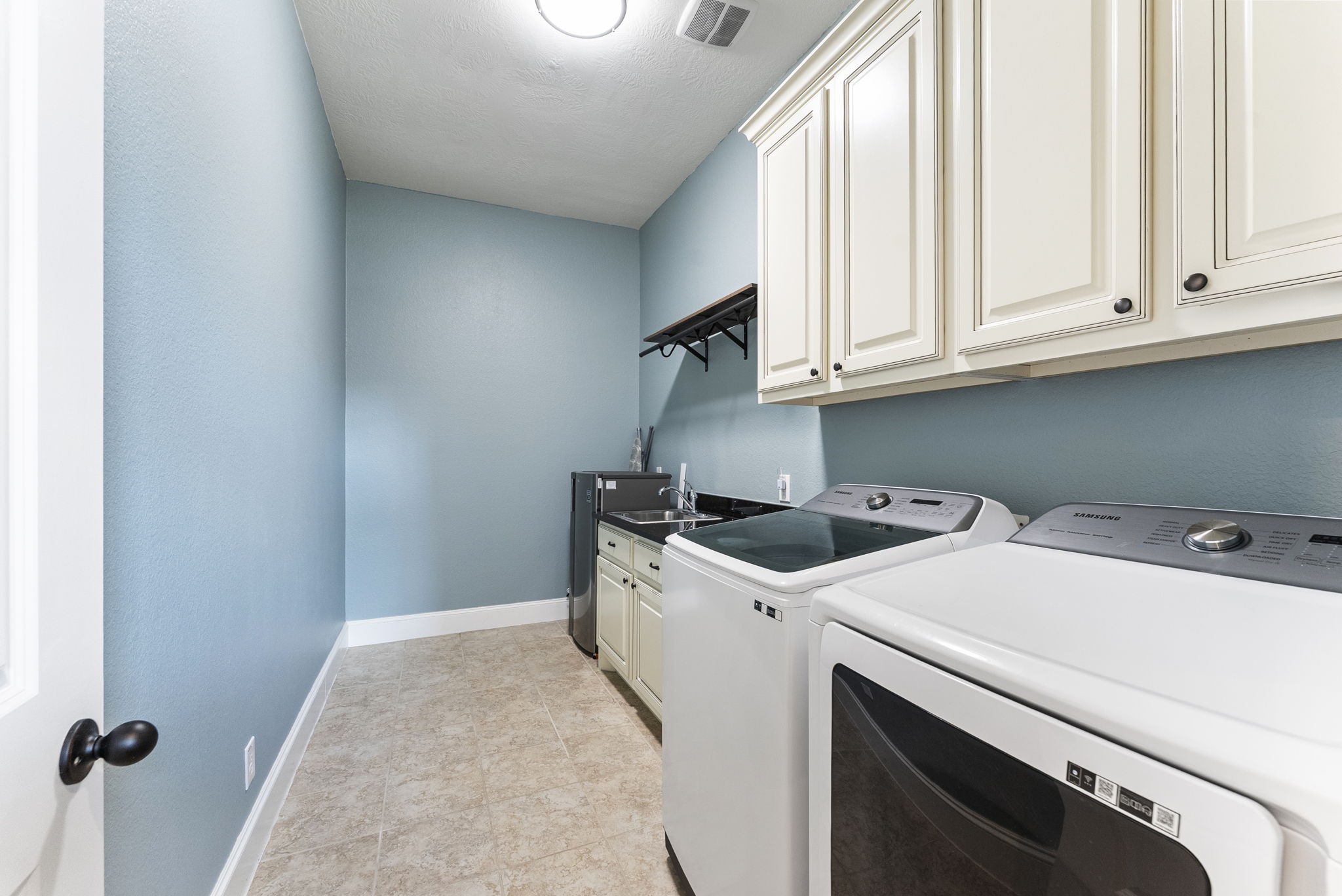 5519 Bright Timber Landing Drive Spring, TX 77386 - Photo 21 of 39 a utility room with dryer and washer