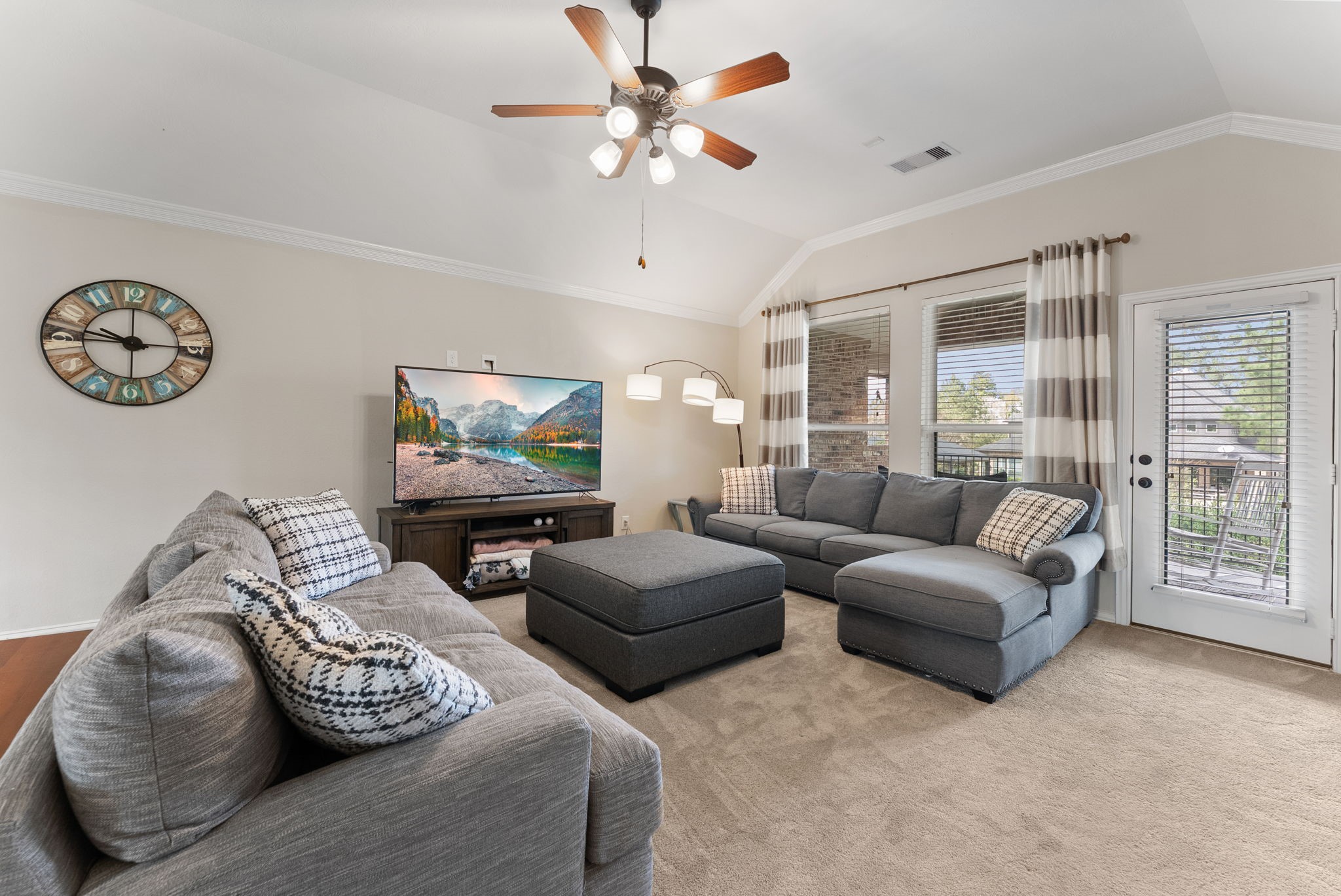 5519 Bright Timber Landing Drive Spring, TX 77386 - Photo 27 of 39 a living room with furniture ceiling fan and a window