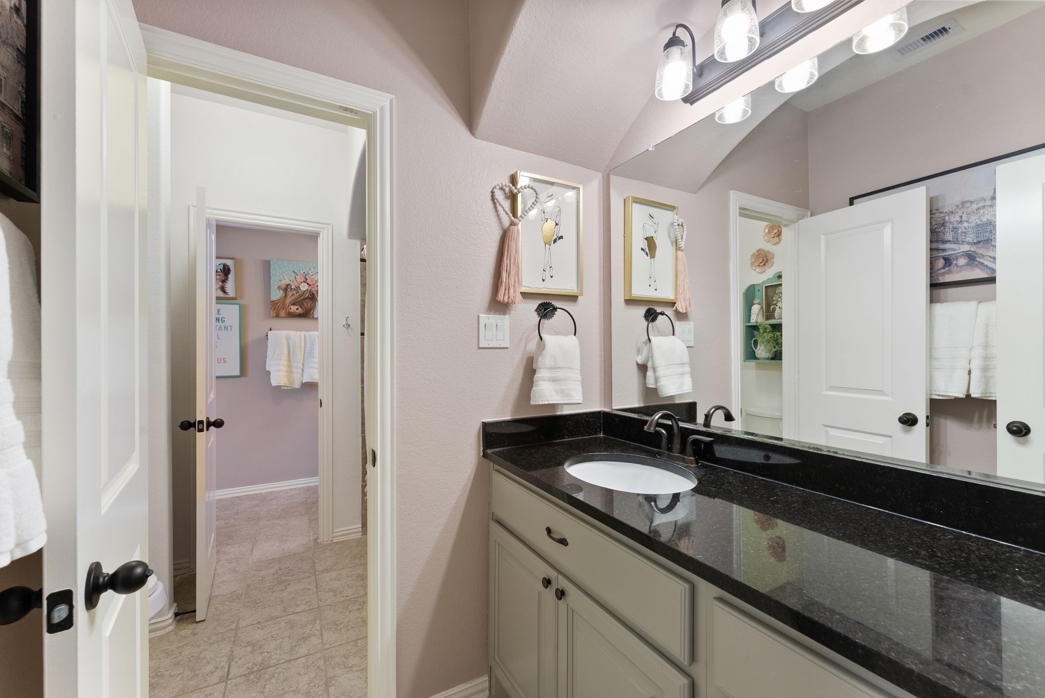 5519 Bright Timber Landing Drive Spring, TX 77386 - Photo 31 of 39 a bathroom with a sink and a mirror
