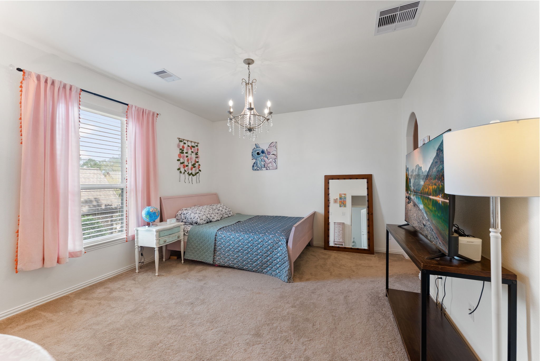 5519 Bright Timber Landing Drive Spring, TX 77386 - Photo 32 of 39 a living room with furniture and a chandelier