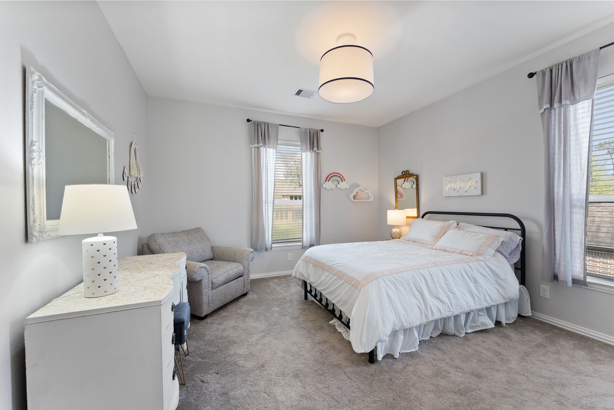 5519 Bright Timber Landing Drive Spring, TX 77386 - Photo 34 of 39 a bedroom with a bed and a chandelier