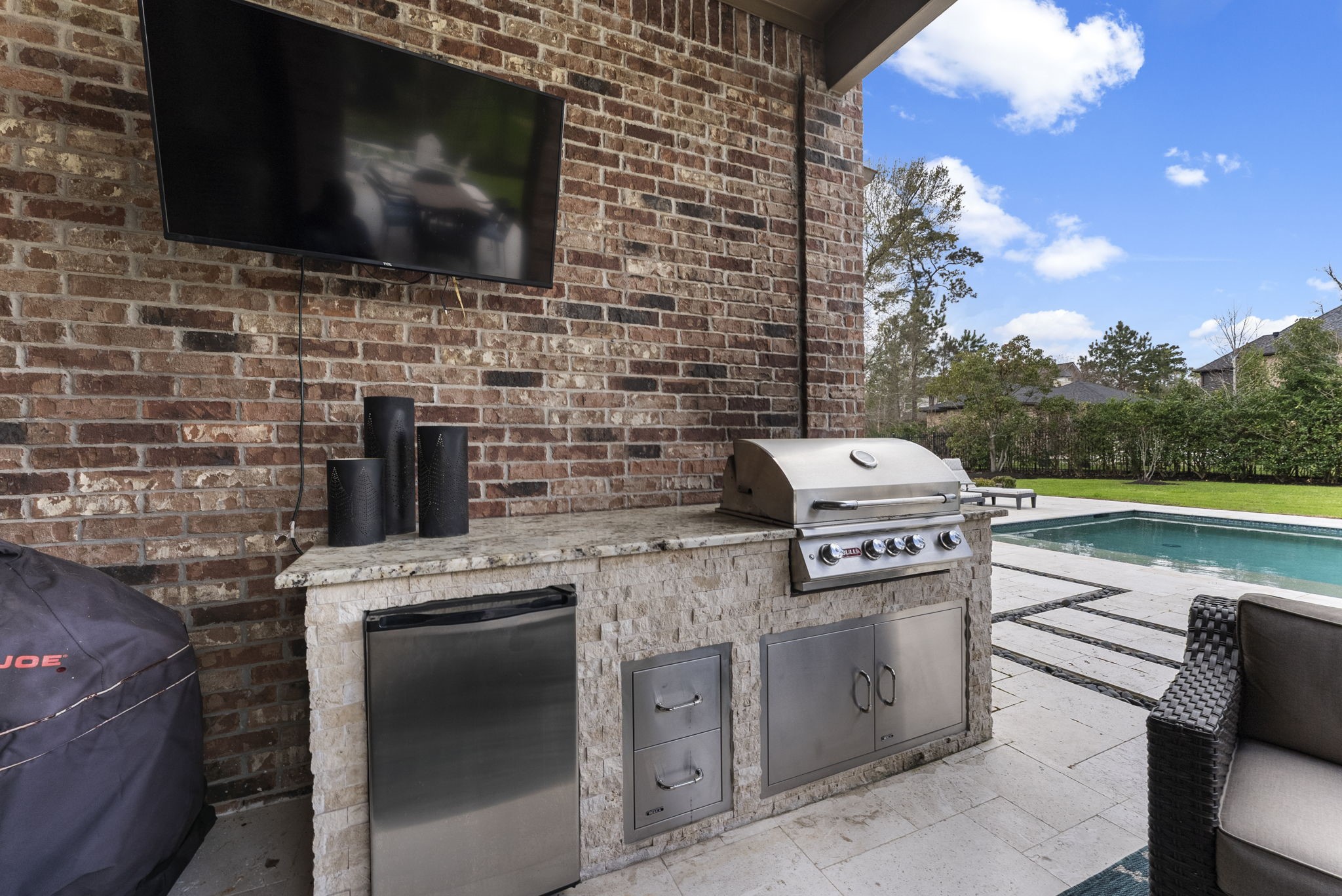 5519 Bright Timber Landing Drive Spring, TX 77386 - Photo 35 of 39 a kitchen with a stove and a microwave