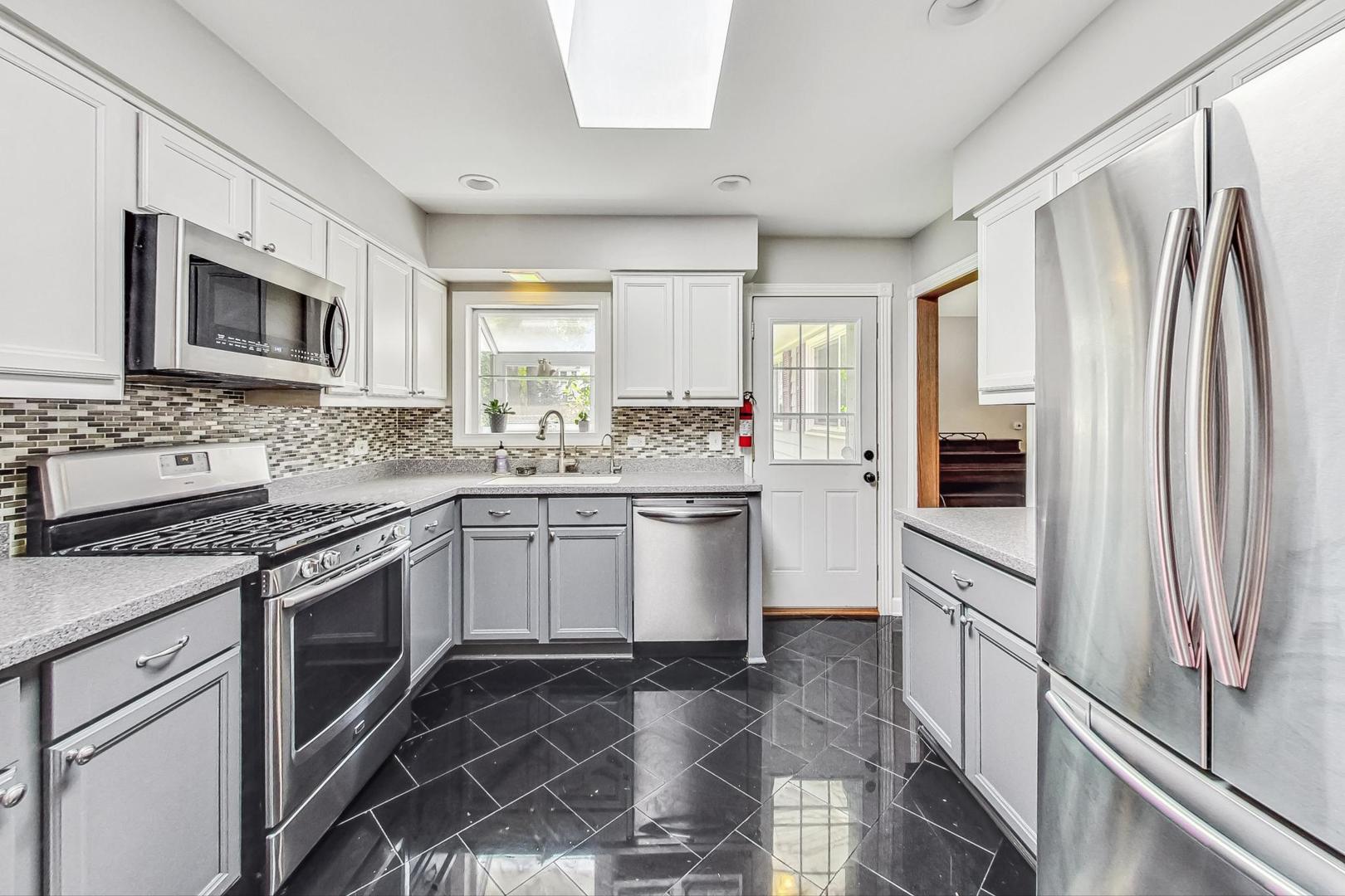 360 South St Marys Road Libertyville, IL 60048 - Photo 11 of 46 a kitchen with stainless steel appliances granite countertop a stove a sink and a refrigerator
