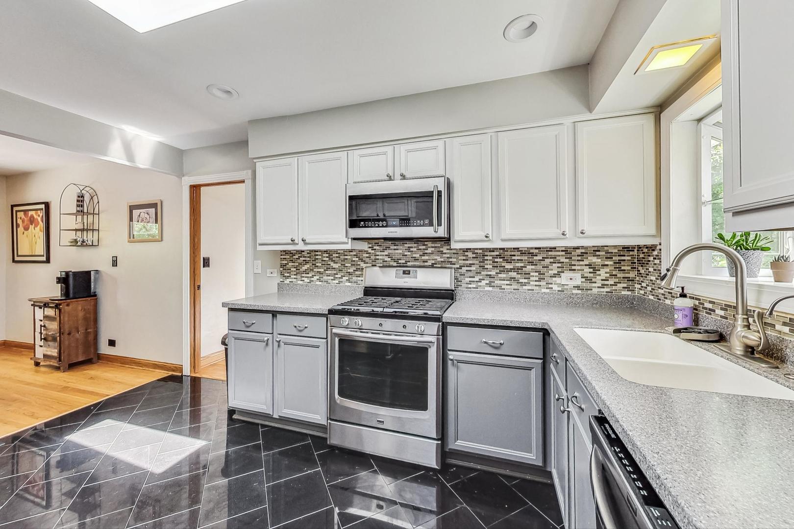 360 South St Marys Road Libertyville, IL 60048 - Photo 12 of 46 a kitchen with cabinets appliances and a sink