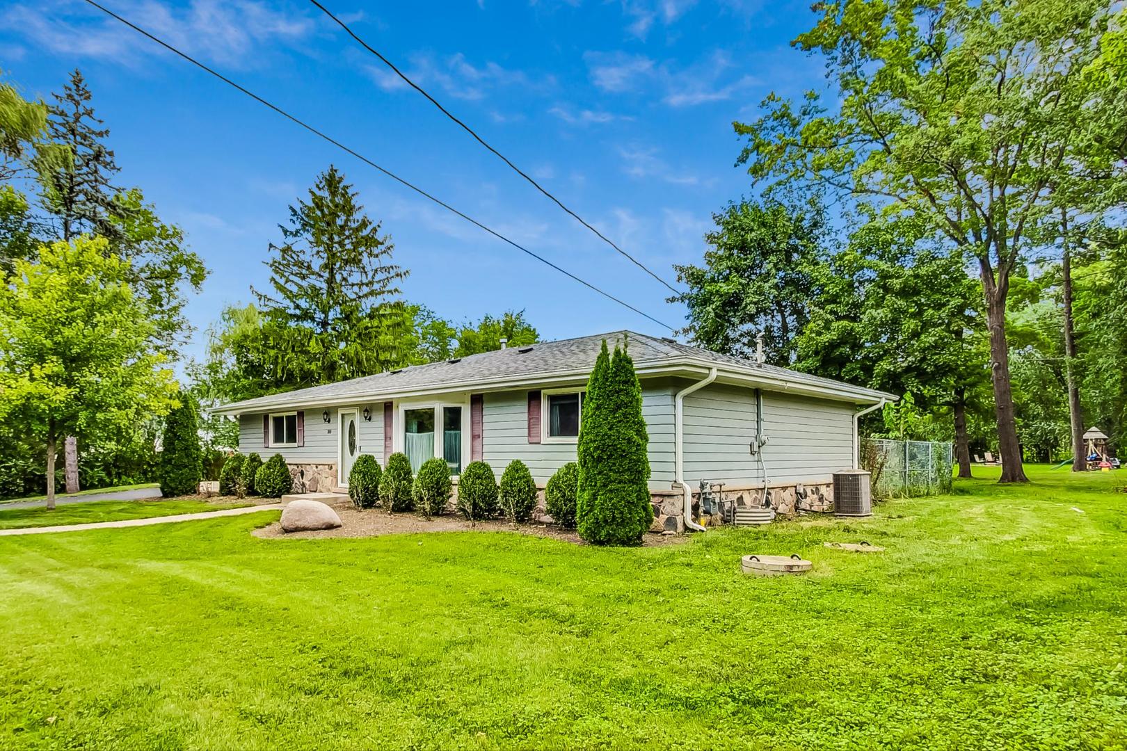 360 South St Marys Road Libertyville, IL 60048 - Photo 2 of 46 a front view of house with yard and green space