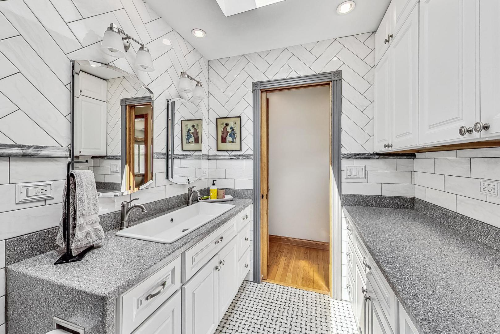 360 South St Marys Road Libertyville, IL 60048 - Photo 21 of 46 a kitchen with a sink stove and cabinets