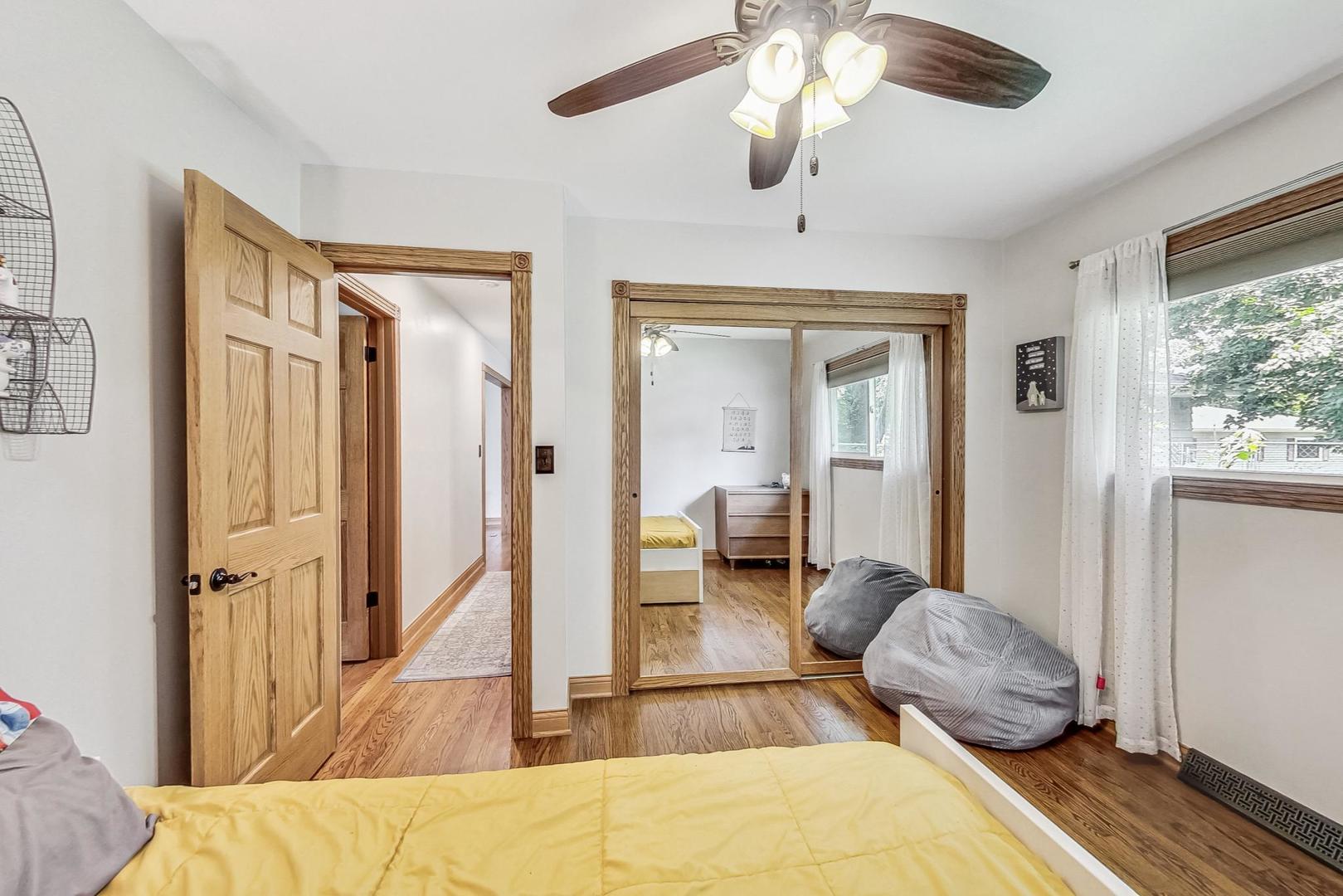 360 South St Marys Road Libertyville, IL 60048 - Photo 27 of 46 a bedroom with a bed and a chandelier