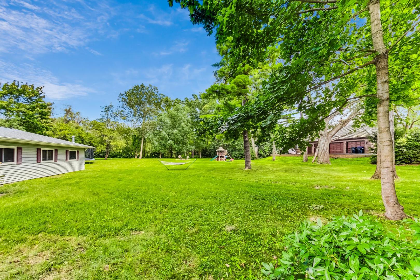 360 South St Marys Road Libertyville, IL 60048 - Photo 33 of 46 a view of a big yard with plants and large trees