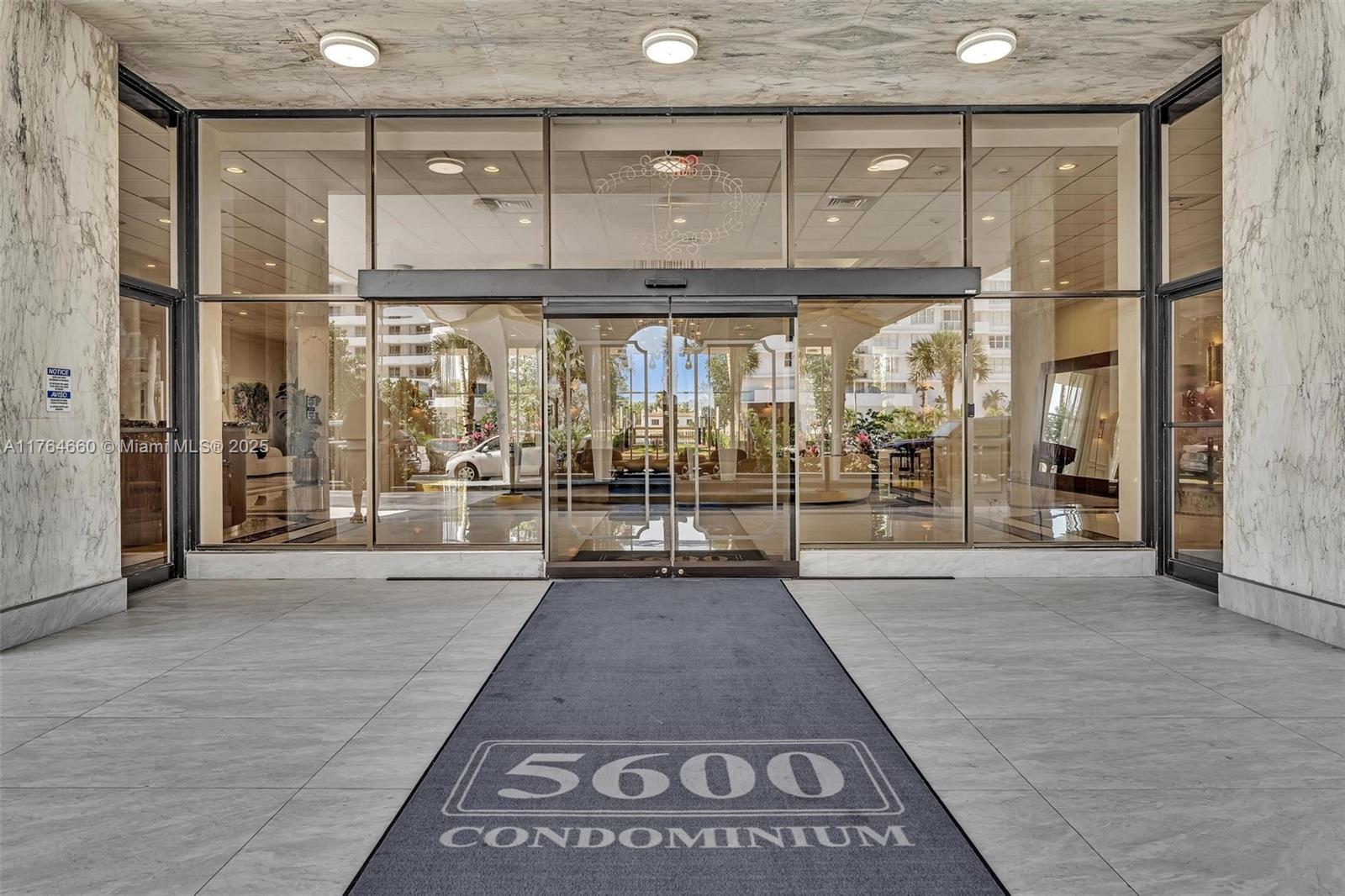 5600 Collins Avenue, Unit 10J Miami Beach, FL 33140 - Photo 14 of 20 a view of a room with wooden floor