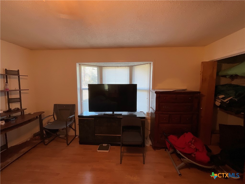 389 Hausmann Road Cuero, TX 77954 - Photo 18 of 48 a living room with furniture and a flat screen tv