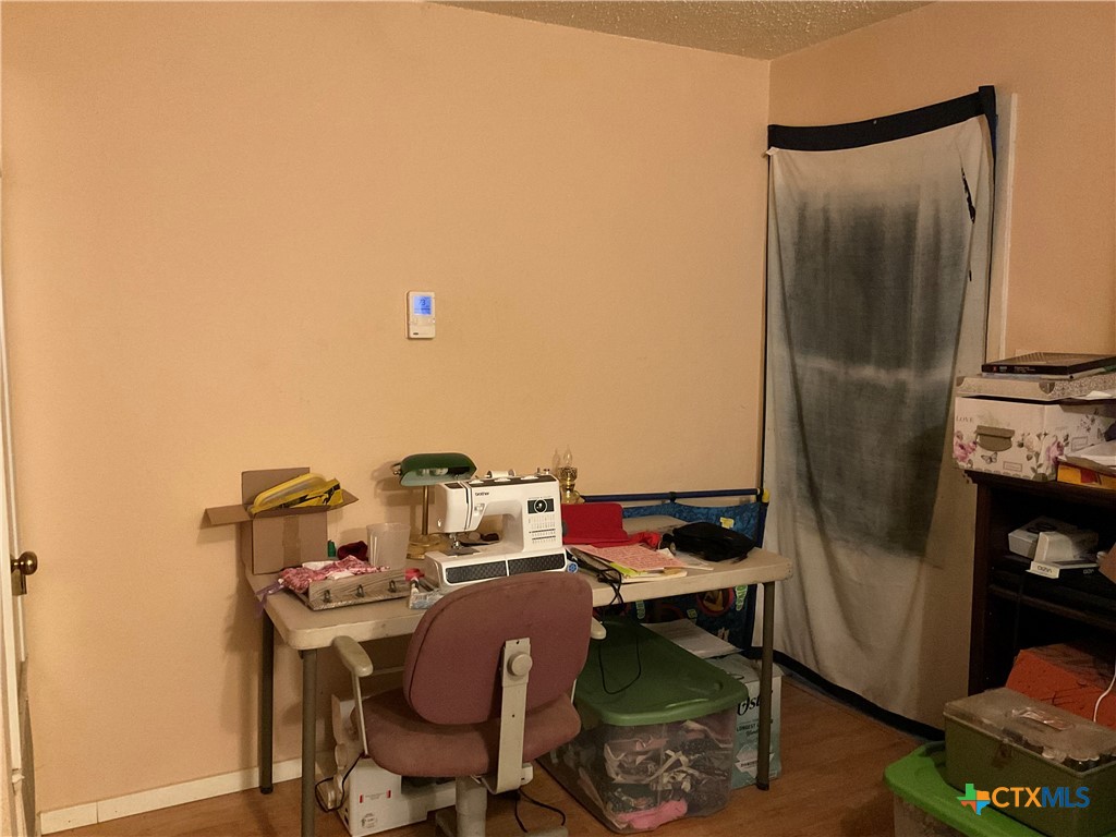 389 Hausmann Road Cuero, TX 77954 - Photo 30 of 48 a workspace with furniture and a table