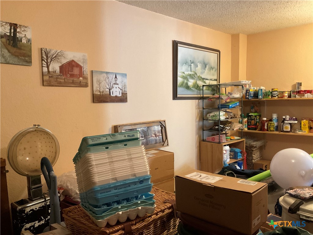 389 Hausmann Road Cuero, TX 77954 - Photo 35 of 48 a room with workspace and a window