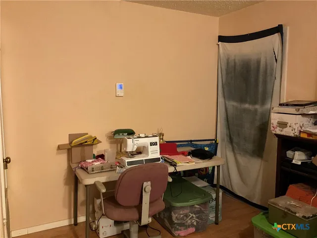 a view of garage with wooden floor