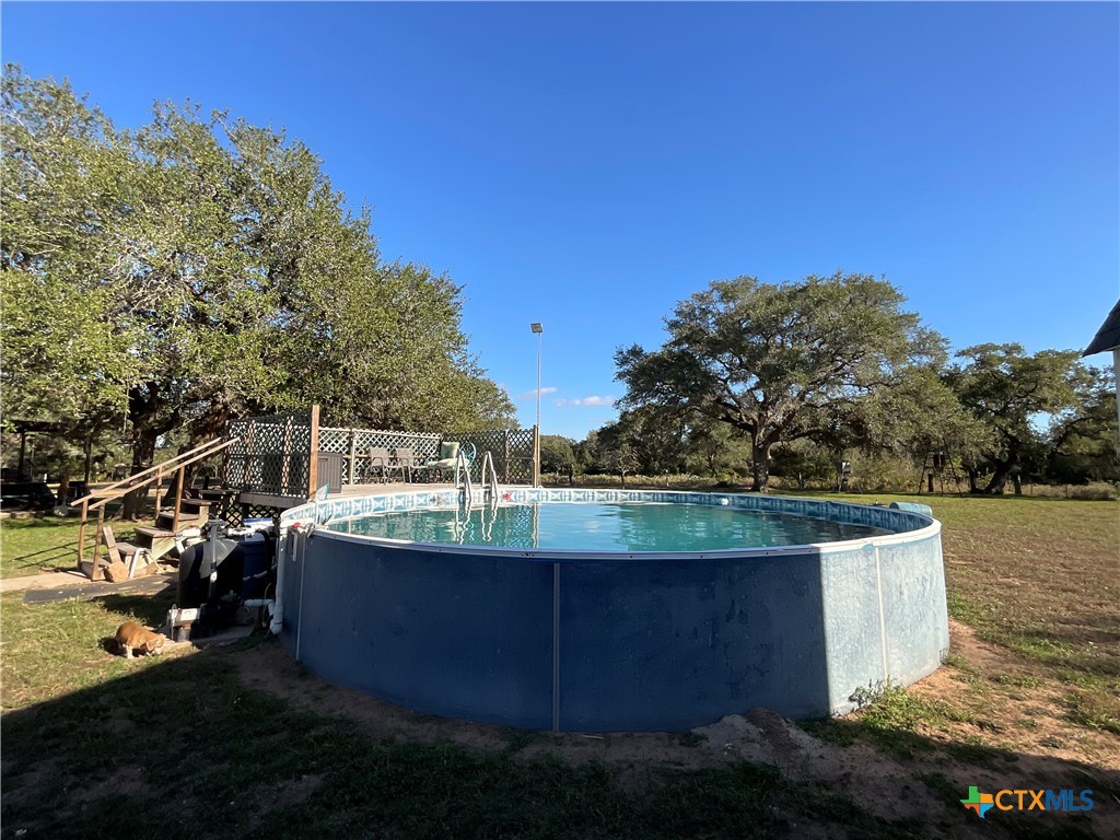 389 Hausmann Road Cuero, TX 77954 - Photo 38 of 48 a view of a house with a yard