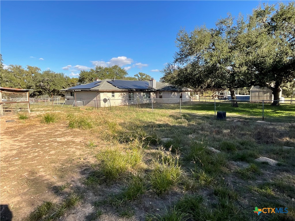 389 Hausmann Road Cuero, TX 77954 - Photo 39 of 48 a view of yard with swimming pool and trees