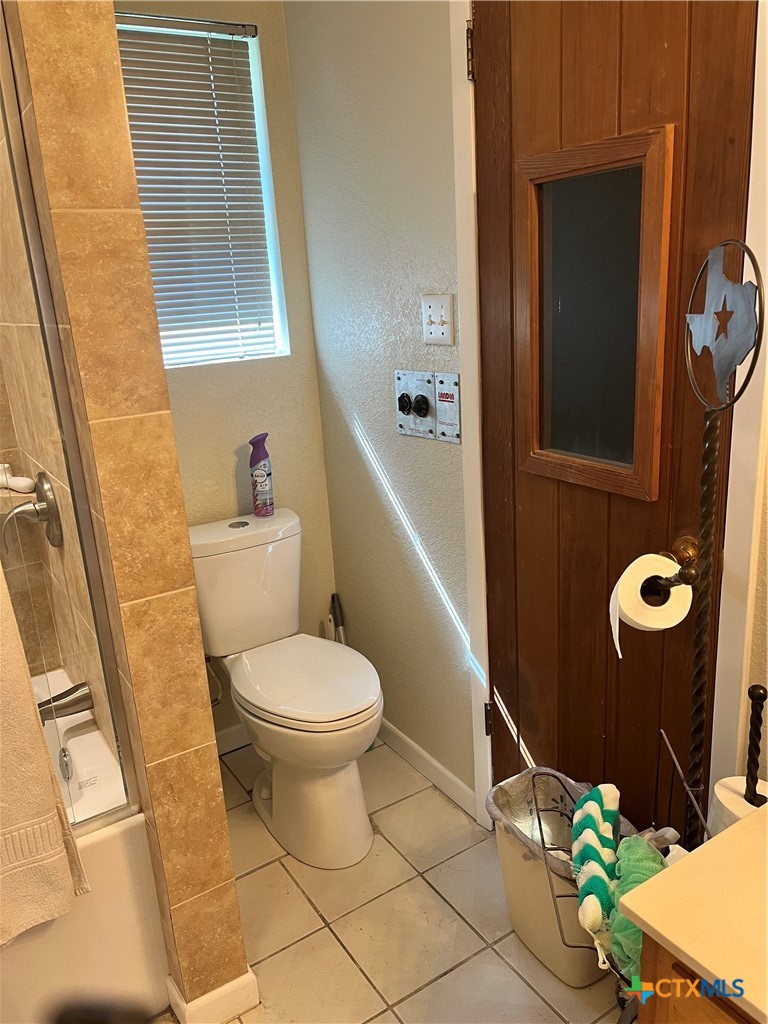 389 Hausmann Road Cuero, TX 77954 - Photo 47 of 48 a bathroom with a toilet and a shower