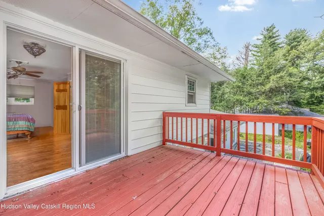 a view of backyard with a deck
