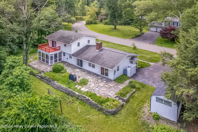 an aerial view of a house with a garden