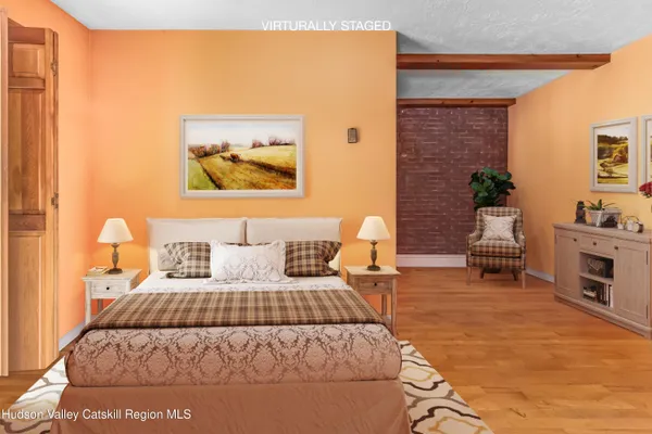 a bedroom with a large bed and a couch