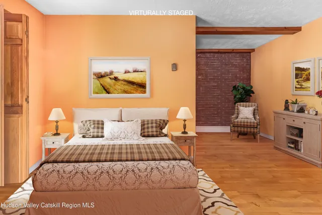 a bedroom with a large bed and a couch