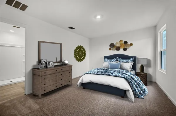 a bedroom with a bed and window