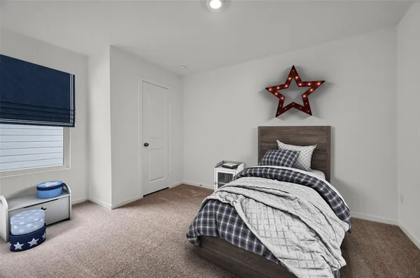 a bedroom with a bed and a tv