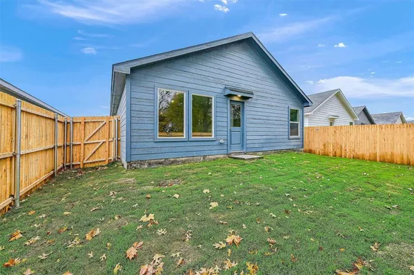 a view of front of house with a yard