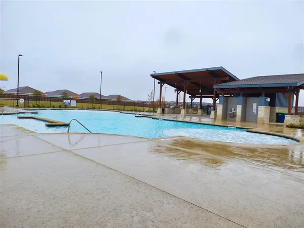 a view of a swimming pool with a lake view