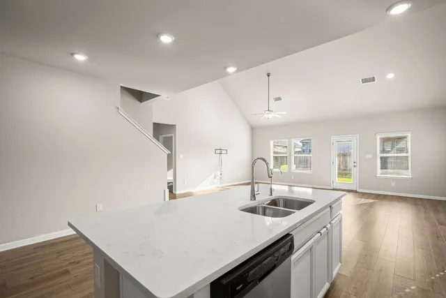 a view of a house with a yard and sitting area