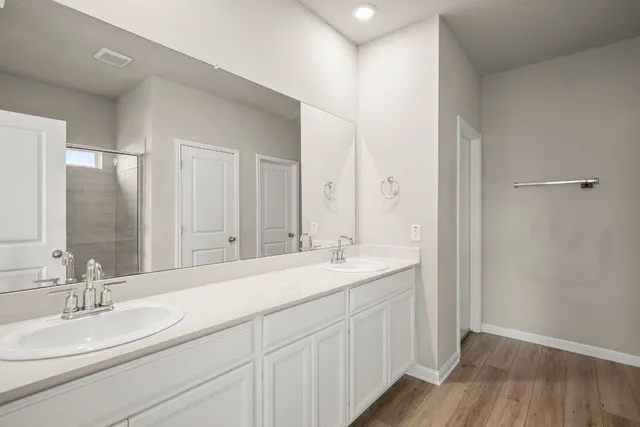 a view of a room with a window and ceiling fan