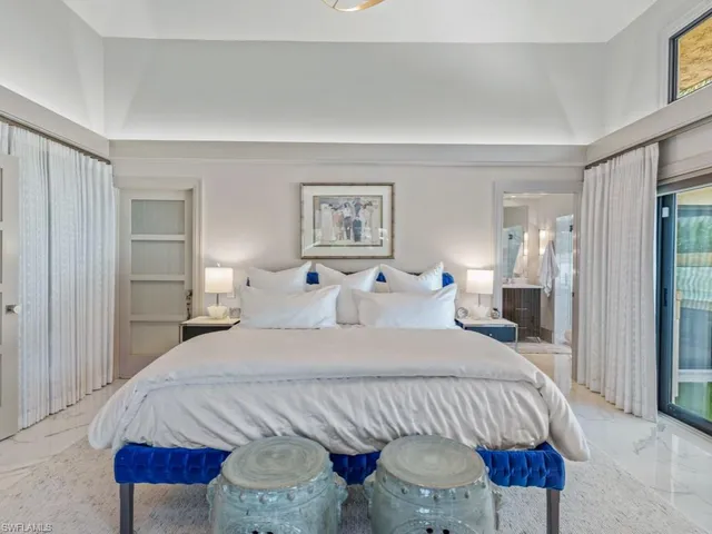 a bedroom with bed and window