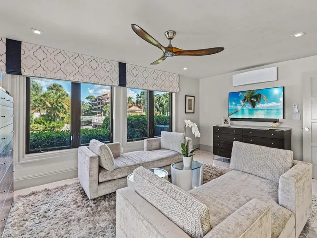 a bathroom with a window and a rug