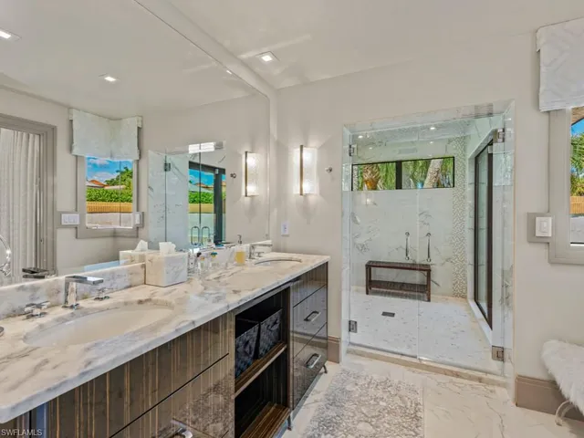 a spacious bedroom with a bed and a large window