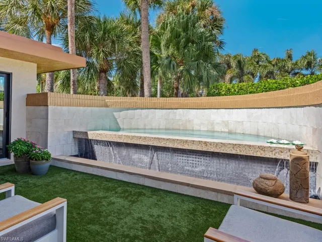 a view of yard with outdoor seating and green space