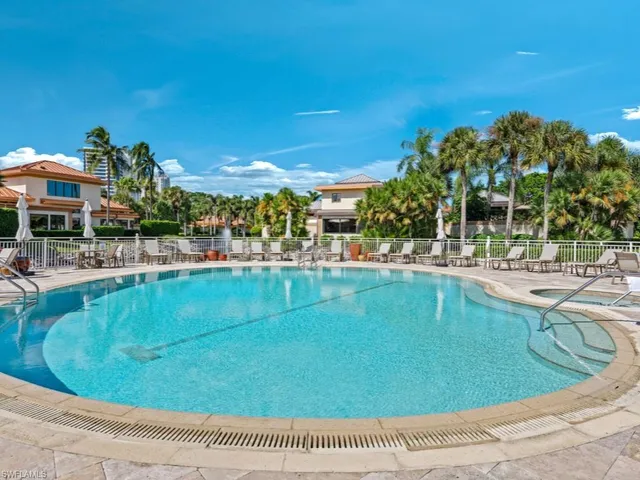 a view of a swimming pool with a yard