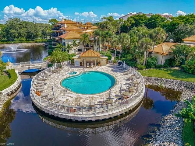an aerial view of a house with yard swimming pool and outdoor seating