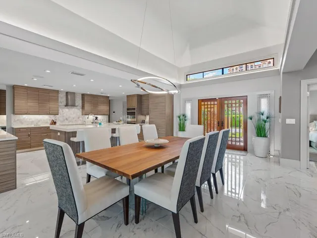 a view of a dining room with furniture and a livingroom
