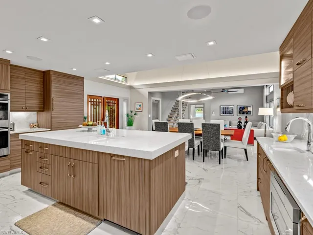 a kitchen that has a lot of cabinets in it