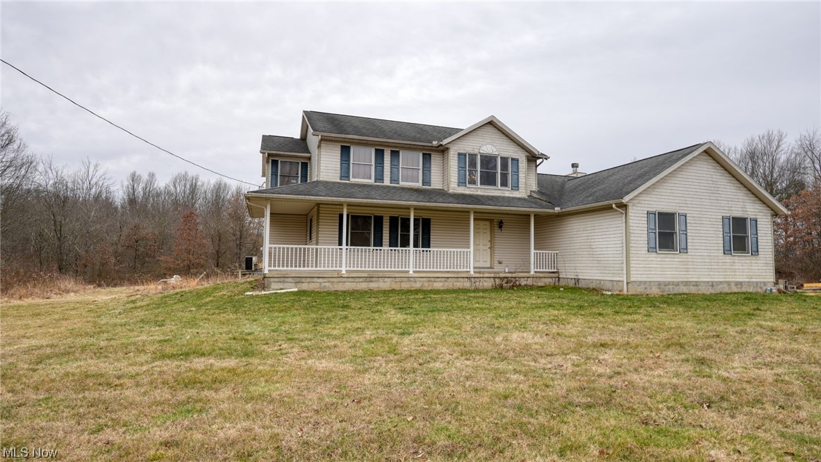 3752 Holmes Road Cambridge, OH 43725 - Photo 2 of 50 View of front of house featuring a front yard and a porch