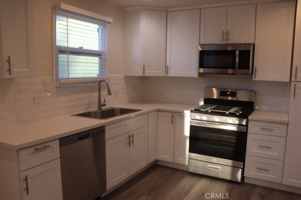 6865 Morro Road, Unit A Atascadero, CA 93422 - Photo 2 of 41 a kitchen with a sink stove and microwave
